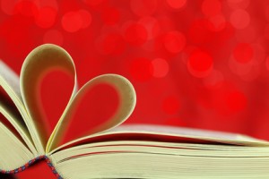 Selective focus image of book pages into a heart shape