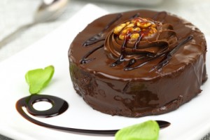 Chocolate dessert with decoration on white plate
