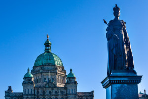 Provincial Capital Legislative Parliament Buildiing Queen Victoria Statue Victoria British Columbia Canada.  Gold Statue top of dome is of George Vancouver.